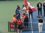 Presentation of medals to the ball crew by Lloyd Glasspool