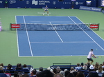 Ben Shelton is returning the serve from Karen Khachanov on Centre Court in the NBO 2025 Championship Final, August 7, 2025