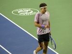 Close-up of Ben Shelton with a sweaty shirt walking on Centre Court during the NBO 2025 Championship match. 