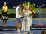 Suzan Rogers is presenting Karen Khachanov with the runner-up's Trophy for the NBO Open 2025