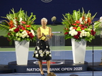 Lucie Blanchet of National Bank is presenting the trophy to the Champion Ben Shelton