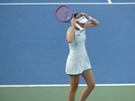 Elena Rybakina on the Court fixin her visor