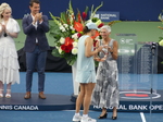 Lucie Blanchet of National Bank is presenting the Championship Trophy