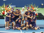 Iga Swiatek is posing with the ball-kids crew