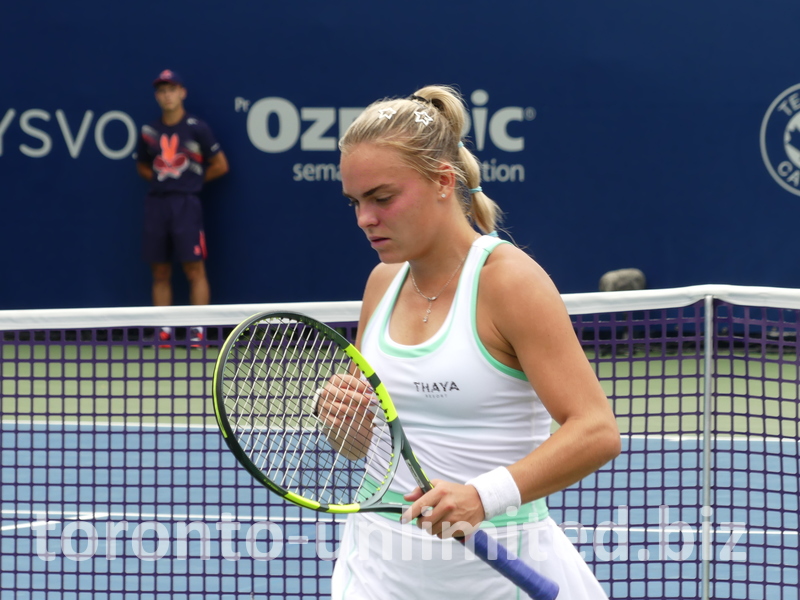 Sara Bejlek shows deep concentration as she walks on the court.