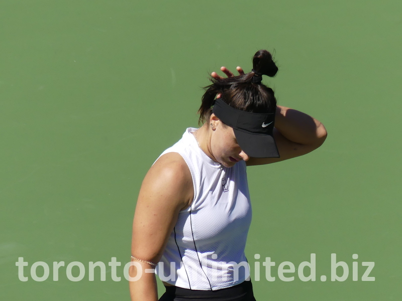 Bianca Andreescu is fixing her hair.
