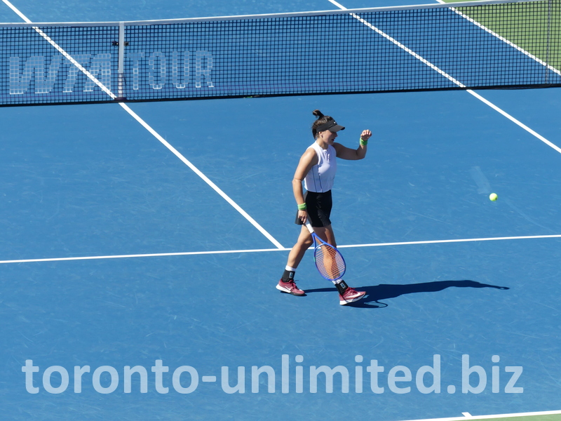 Bianca Andreescu is walking on the Centre Court.