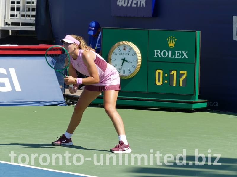 Mira Andreeva is expecting a serve in front of a Rolex timepiece