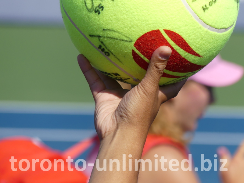 A souvenir tennis ball signed by the winner, Mirra Andreeva.