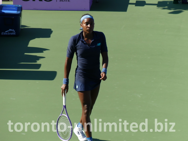 Coco Gauff is walking casually on Centre Court