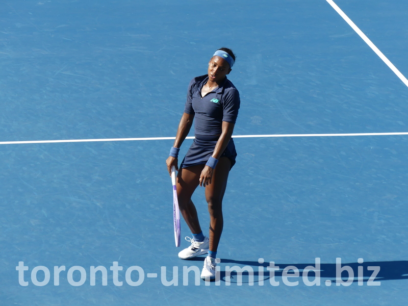Coco Gauff is walking casually on Centre Court