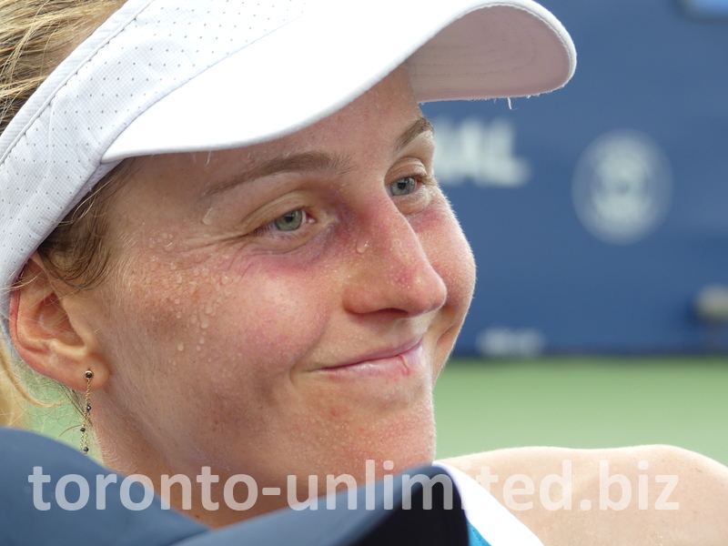 Sweaty, but happy Liudmila Samsonova's face.