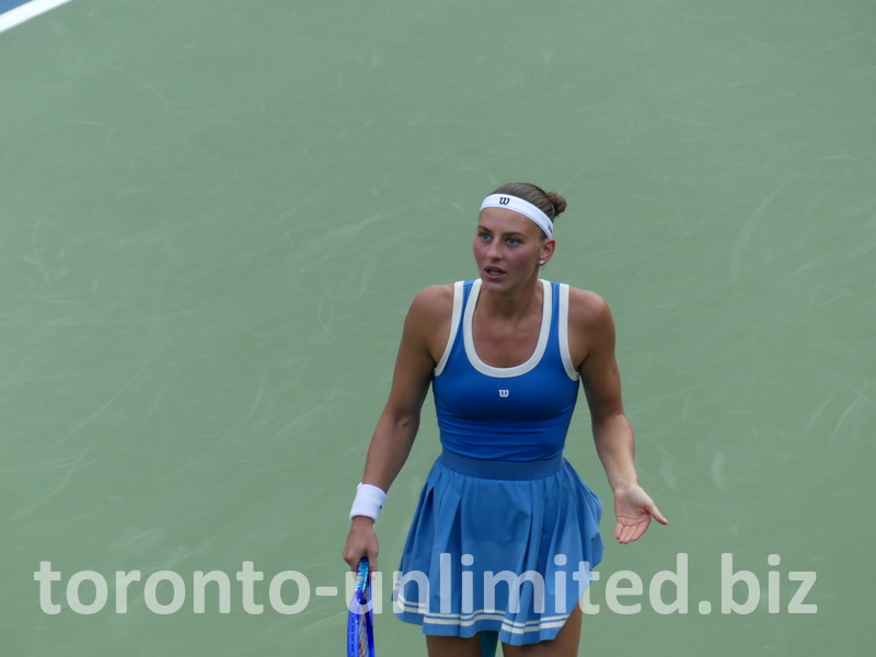 Marta Kostyuk gesticulates on the Court.