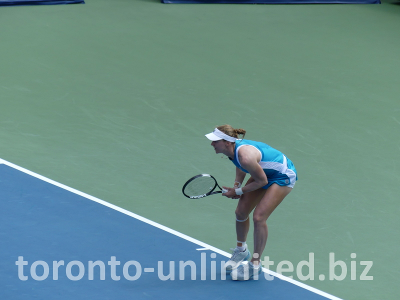 Liudmilla Samsonova waits to receive serve behind the baseline.