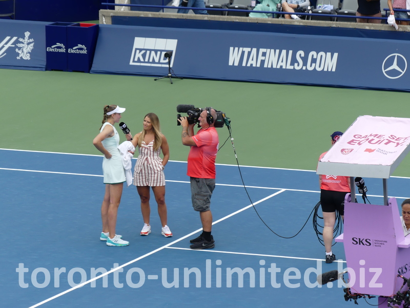Victorious Elena Rybakina in the on-court post-game interview by a WTA Tour reporter.