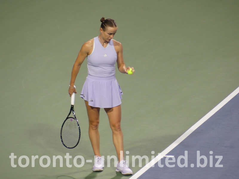 Ekaterina Alexandrova is preparing to serve.