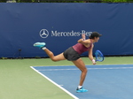 Watch Xiyu WANG in the serve closing motion.