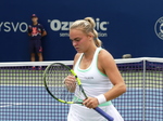 Sara Bejlek shows deep concentration as she walks on the court.