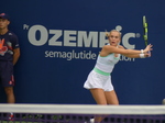 Sara Bejlek is watching the tennis ball to strike it.