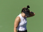 Nikola BARTUNKOVA behind baseline expecting to return serve.