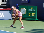 Mira Andreeva is expecting a serve in front of a Rolex timepiece
