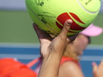 A souvenir tennis ball signed by the winner, Mirra Andreeva.