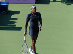Coco Gauff is walking casually on Centre Court