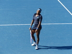 Coco Gauff is walking casually on Centre Court