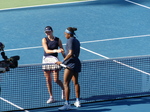Coco Gauff has just won her match against Kayla Day, and they are shaking hands.