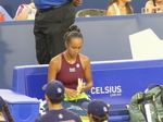Leylah Fernandes snacks on a banana during the break.