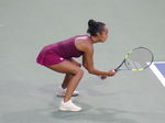 Crouching and concentrated, Leylah Fernandes waits for the serve ball.
