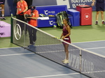 A match winner, Leylah Fernandes, is waiting for Renata Zarazua to shake hands.