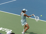 Iga Swiatek is about to hit the forehand shot behind the baseline.