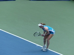 Liudmilla Samsonova waits to receive serve behind the baseline.