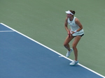 See Elena Rybakina posturing as she braces to return a shot.