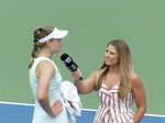 A closeup of Elena Rybakina with a WTA Tour Reporter.