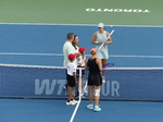 Diana SHNAIDER and Iga SWIATEK come to the Court, posing for photos and for a coin toss.