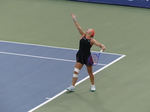 What a high ball toss; Diana Shnaider follows with her eyes for her serve.