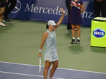 Victorious Iga Swiatek celebrates on the Court.