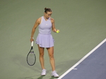 Ekaterina Alexandrova is preparing to serve.