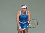 Elina Svitolina in a serve-preparation posture.