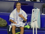 Ekaterina Alexandrova rests during the changeover.