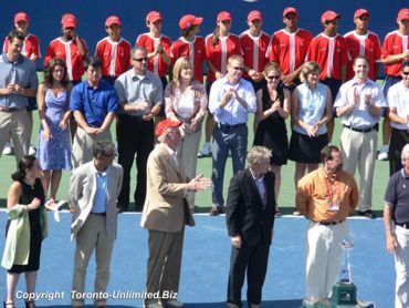 Cable Mogul Ted Rogers 3rd from the left, with the red hat. 