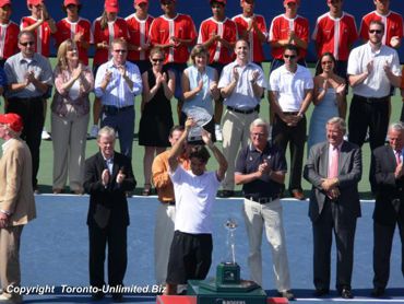 Roger Federer with his Championship Trophy.