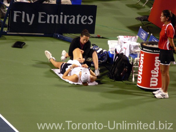 Alisa Kleybanova with trainer's assistance.