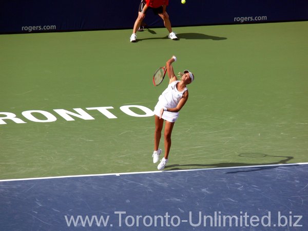 Aleksandra Wozniak of Canada serving.