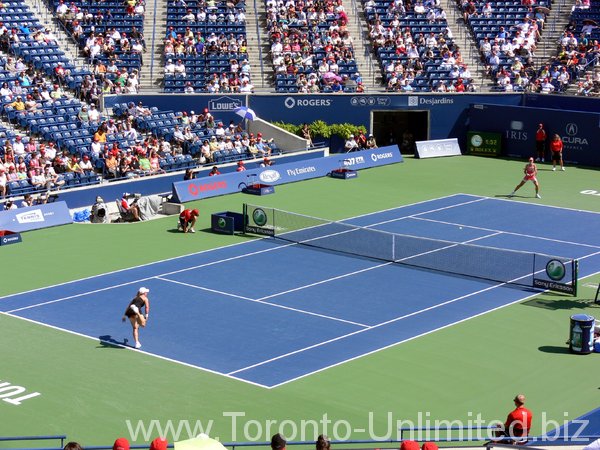 Stosur serving agianst Elena Dementieva on Stadium Court.