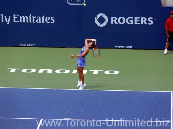 Amelie Mauresmo serving.