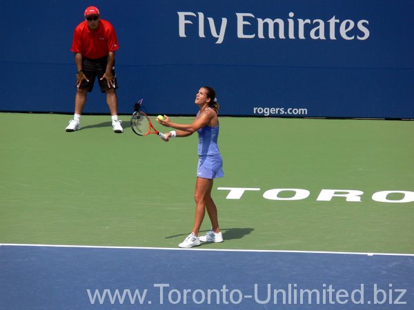 Amelie Mauresmo serving.