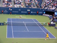 Alisa Kleybanova in further court and Jelena Jankovic in front.